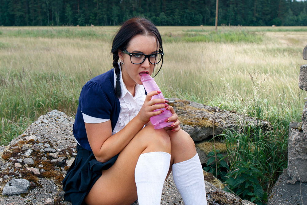 Pigtailed Young schoolgirl Outdoord with big pink dildo toy