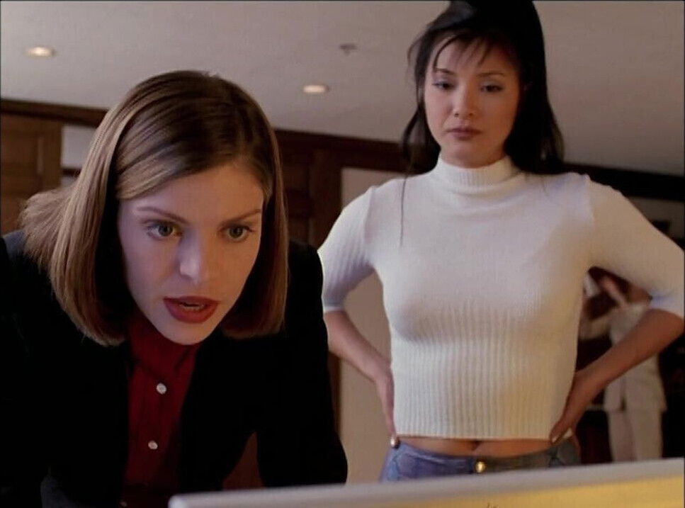 Kelly Hu in skintight snakeskin vinyl pants