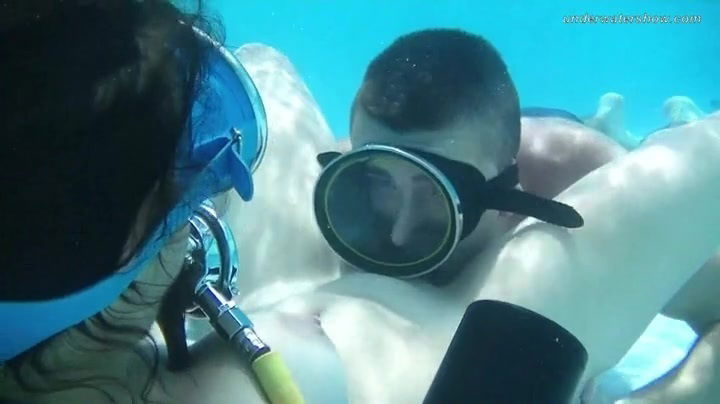 Eating pussy underwater with a scuba diving girl