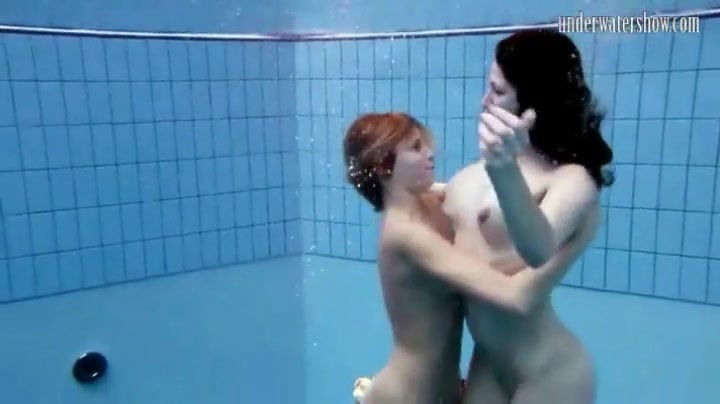 Two cute naked girls go swimming