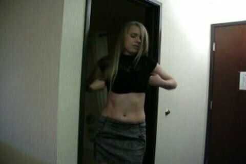 Blonde girl stripping.