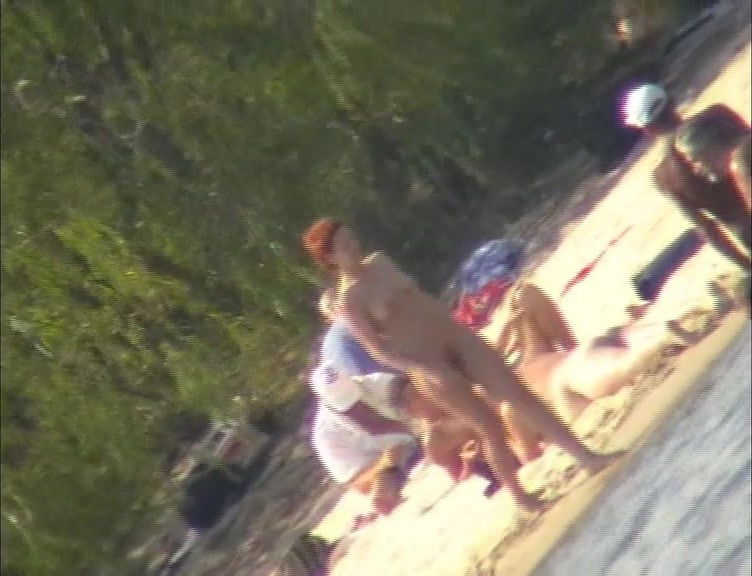 Nude couples relaxing on the beach and shot on cam