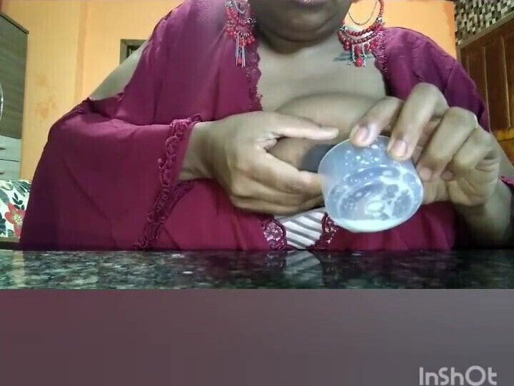 Brazilian woman squeezes milk from big tits