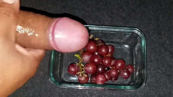 Unloading fresh over juicy grapes. Delicious summer snack.