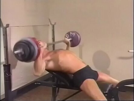 Darkhaired workout fanatic Karl Thomas explains newcomer member David Griffin code behavior club