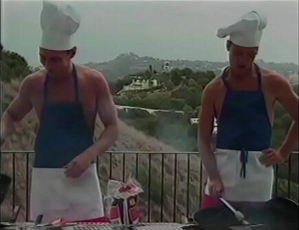 Couple Naked Chef Paul Morgan'_s assistants Matt Young Marc Hamilton prepare barbeque sausages their