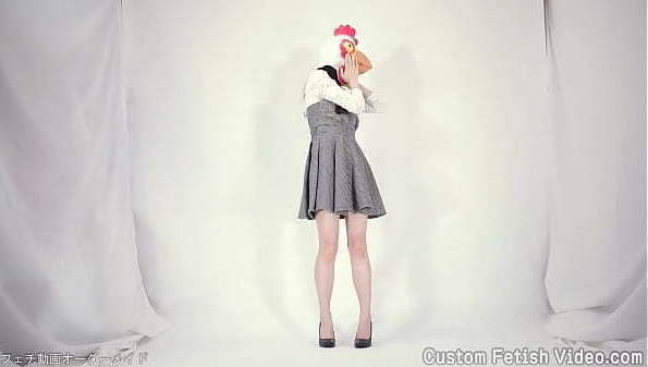 Woman wearing chicken headpiece