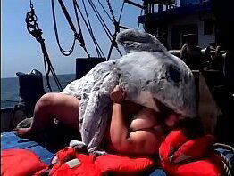 Huge bitch Tia Davis gets fucked and creamed by a man in a dolphin costume on the ship