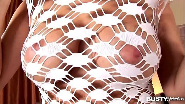 Busty sensation Natalia strokes round titties