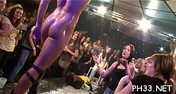 Girls holding weenies in both hands and engulfing them in turn relish