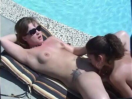 Gorgeous brunette girls Magen Jessi licking fucking another lounger near pool