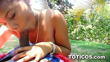 Dominican babe giving black tourist a blowjob out on hotel grounds
