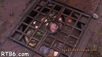 Caged cutie removes charming clothings captivity