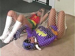 BatGirl trapped in a net