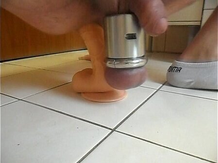 with heavy stretched balls fucks dildo