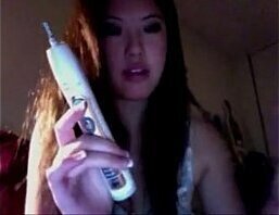 Asian Camgirl Beauty Uses Toothbrush Dildo