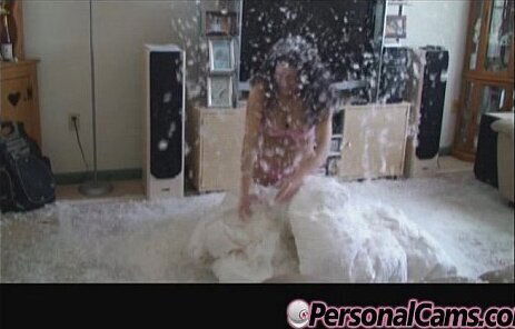 Amateur brunette with plays with feathers