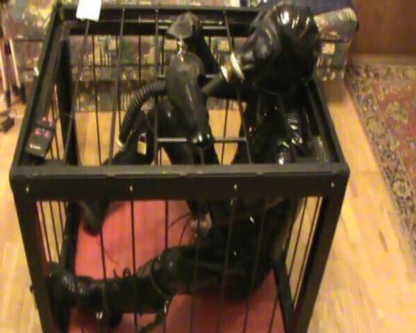 Caged rubberslave