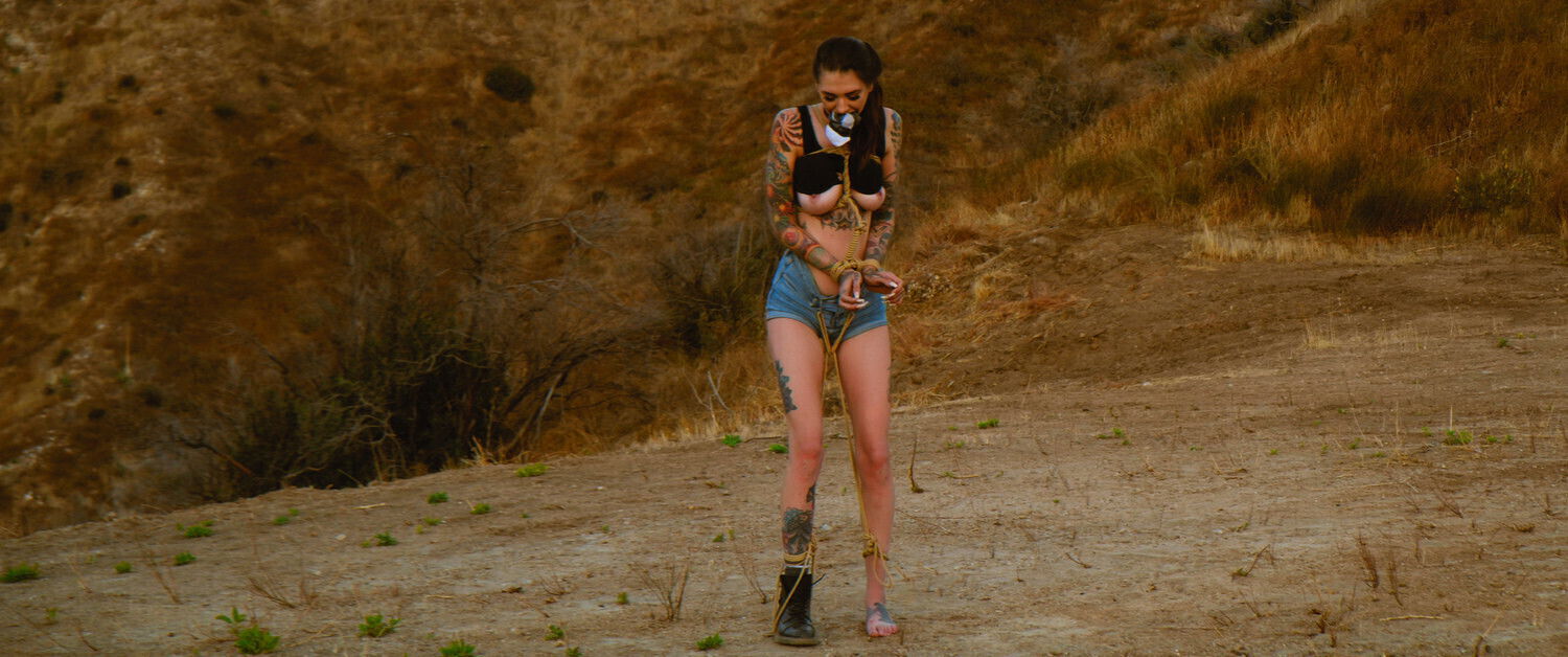 Submissive masochist Rocky Emerson bound caned