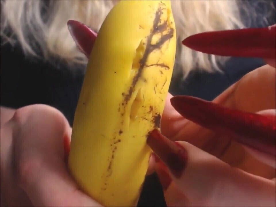 Katiegodess long sharp nails sctratching banana