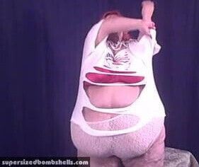 Obese gilf plays with belly