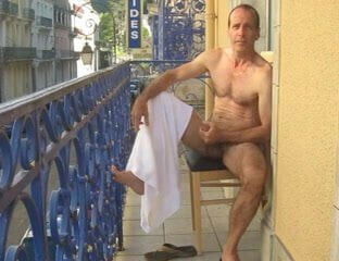 Naked balcony wank