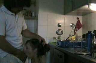 Amateur couple fucks in kitchen