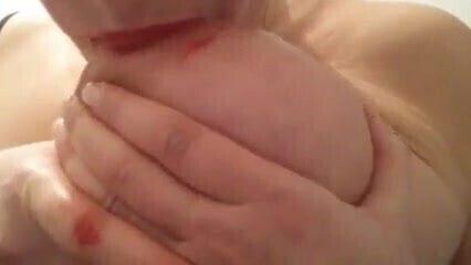 Sucking nipple with lipstick