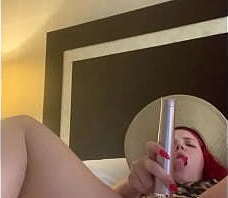 Redhead cheetah print plays with herself