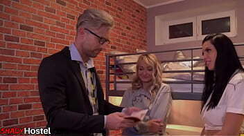 European backpackers in hostel threesome with manager