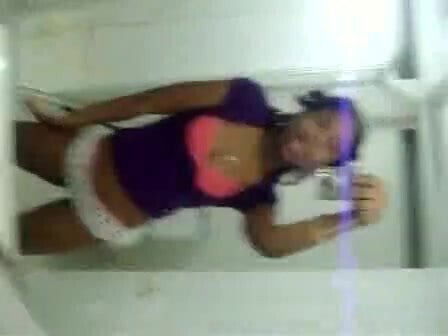 Cute black girl records herself teasing bathroom