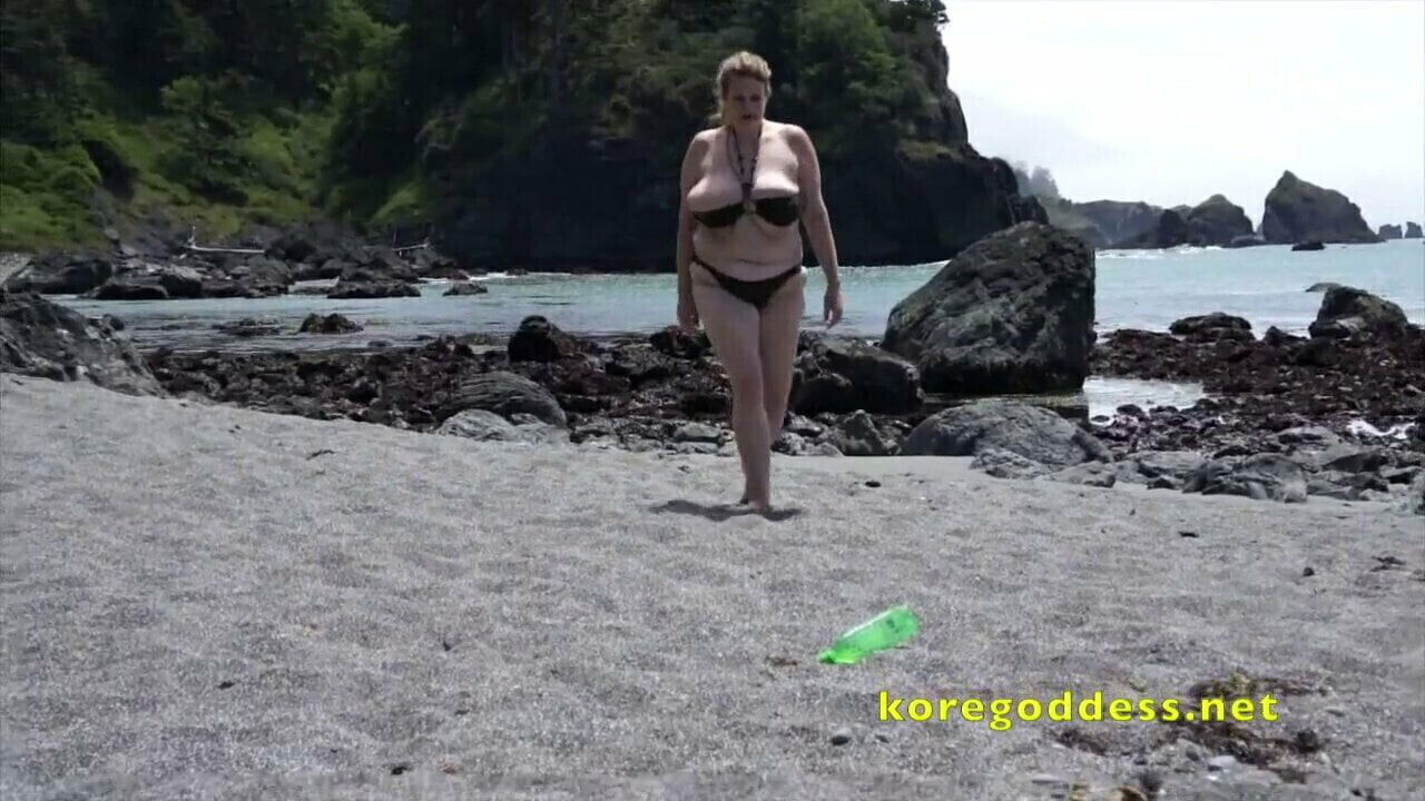 woman beach masturbates