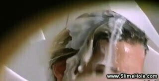 Slut rubs against gloryhole