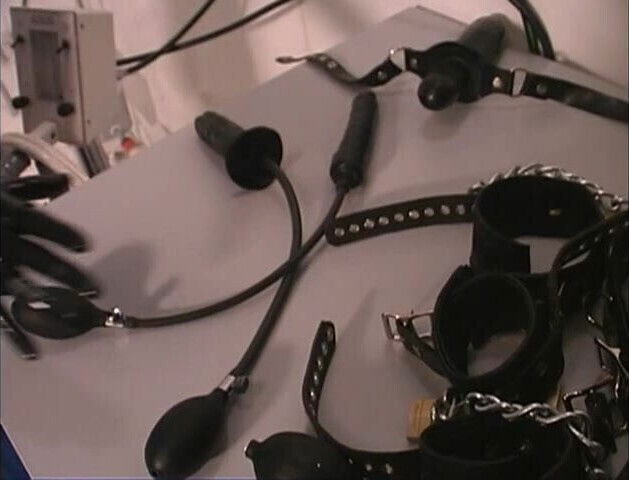 Slut dressed in latex and gagged