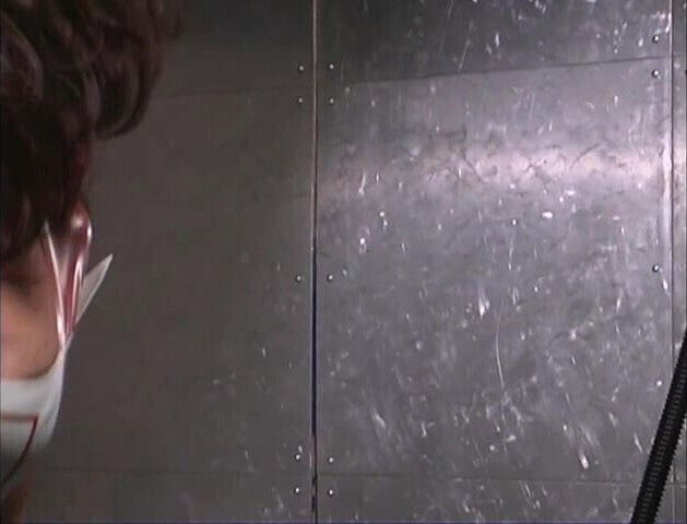 Mistress places latex suit