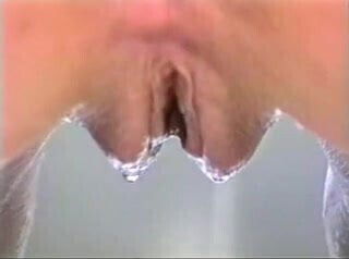 Pretty blonde masturbates while having a bubble bath