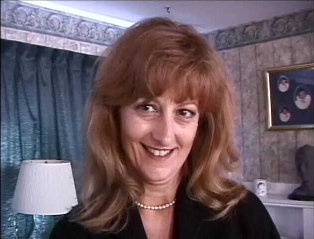 Mature big tits whore getting ready for a BDSM session