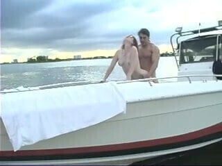 Mature male fucks young girl with glasses on at the beach then on a boat 