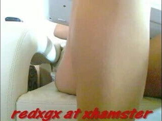 Latina with bright yellow nails on webcam