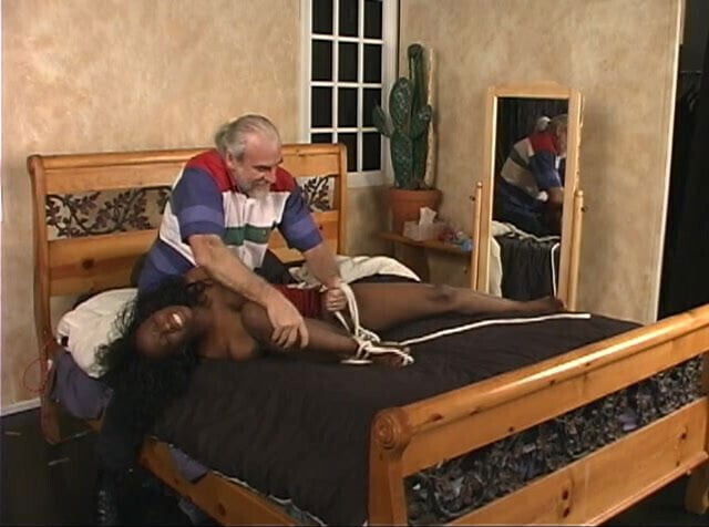 Masturbating black beauty gets captured and bounded by ponytailed dude