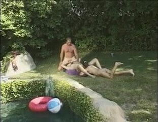Horny babes and dudes in hardcore orgy by pool 