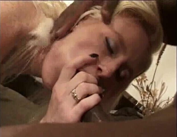 Long haired blonde makes love black with mouth