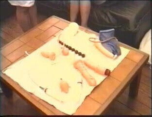 Doctor shoves various items brunette's pussy