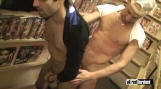 Bareback threesome in a sexshop