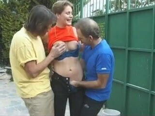 Construction workers drinking coffee with housewife