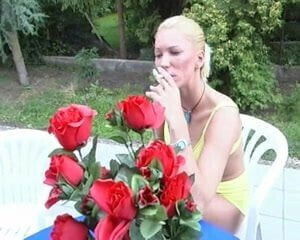 Shaved blonde smokes cigarette fucks outdoors