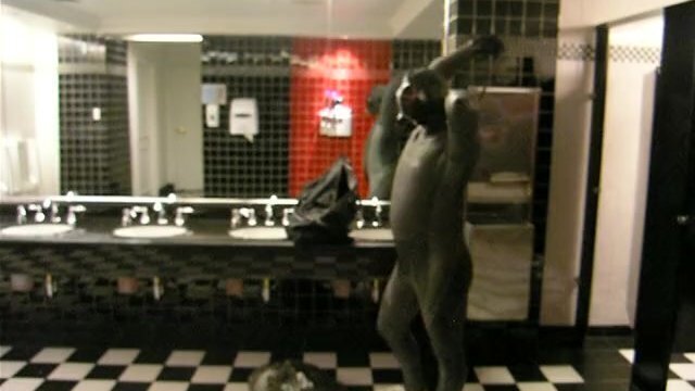 Thief changes into fully lubed rubber gear public washroom