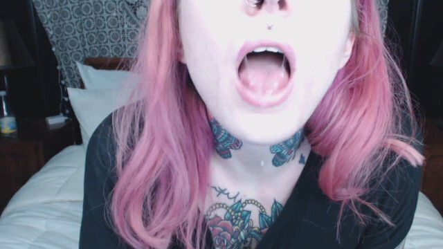 pink haired girl holds mouth wide open