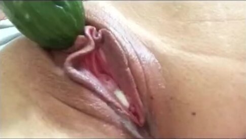 Tiny teen with creamy pussy fucks cucumber