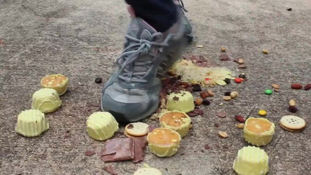 MILF crushes food under heels outdoors